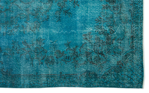 Load image 1 in gallery view. Teal distressed rug with a faded black floral pattern and a decorative border.