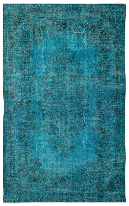 Load image 1 in gallery view. Teal distressed rug with a faded black floral medallion pattern and a decorative border on a white background.