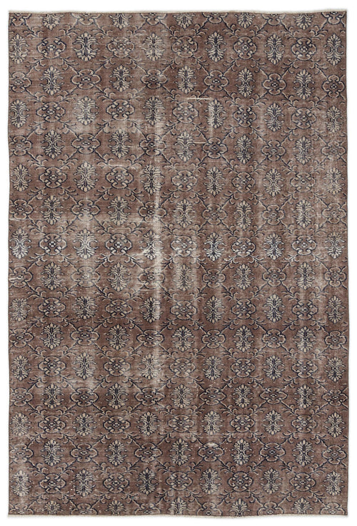 Load image 1 in gallery view. Brown and dark blue distressed rug with an all-over repeating floral medallion pattern.