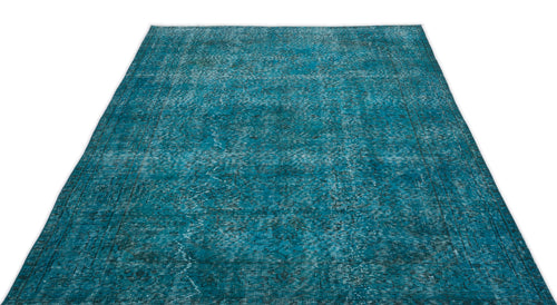 Load image 1 in gallery view. Teal distressed area rug with a faded traditional medallion pattern on a white background.