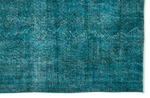 Load image 1 in gallery view. Teal distressed rug with a faded traditional floral medallion pattern and a linear border.