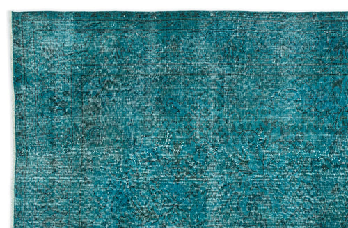 Load image 1 in gallery view. Teal and black distressed vintage-style rug with a faded traditional floral pattern.