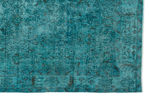 Load image 1 in gallery view. Teal distressed rug with a dark grey traditional floral pattern and a bordered edge.