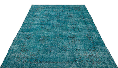 Load image 1 in gallery view. Teal distressed area rug with a faded traditional medallion pattern on a white background.