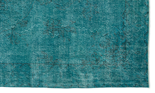Load image 1 in gallery view. Teal distressed rug with a faded black traditional floral pattern and a thin border on a white background.