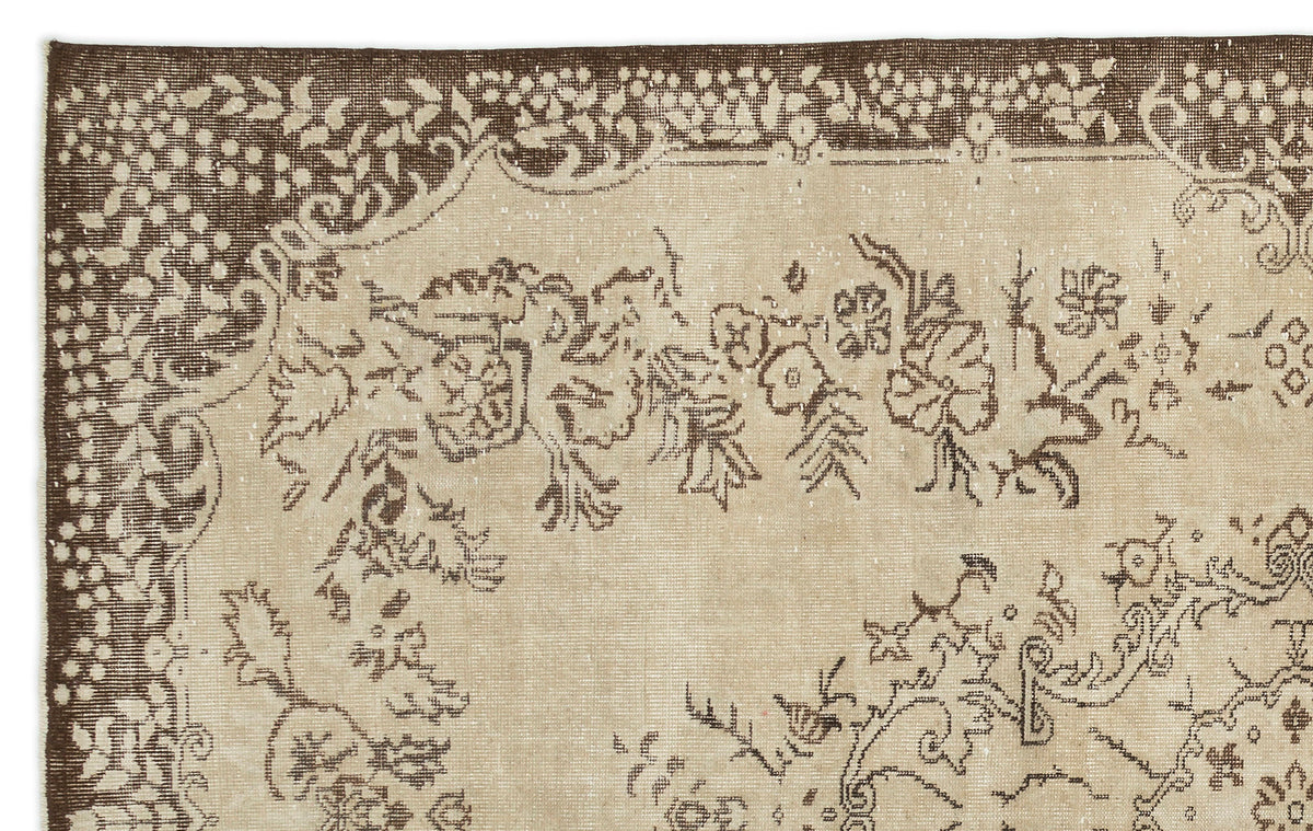 A close-up of the Tiduex Vintage Medallion Rug (6'3" x 9'11") shows its beige background and ornate brown floral and vine border, featuring detailed motifs inspired by classic Anatolian rug craftsmanship.