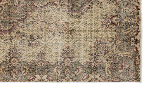 Load image 1 in gallery view. Distressed beige, olive green, and burgundy rug with a traditional floral medallion and geometric pattern.