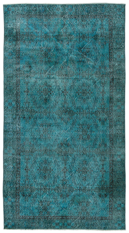 Load image 1 in gallery view. Teal and black distressed vintage-style rug with a faded central medallion and ornate border pattern.