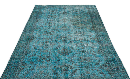 Load image 1 in gallery view. Distressed turquoise and black area rug with a traditional medallion pattern on a white background.