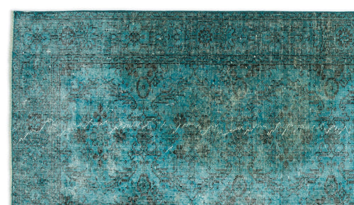 Load image 1 in gallery view. Teal and black distressed rug with a faded traditional floral medallion pattern.