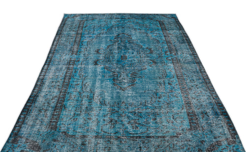 Load image 1 in gallery view. Distressed teal and black area rug with a traditional central medallion and ornate border pattern on a white background.