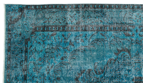Load image 1 in gallery view. Teal and black distressed traditional rug with a faded floral medallion pattern and a geometric border.