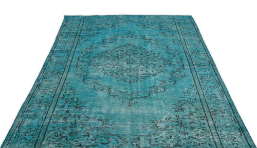 Load image 1 in gallery view. Distressed turquoise rug with a dark charcoal floral medallion and border pattern on a white background.