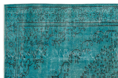 Load image 1 in gallery view. Teal rug with a distressed black floral pattern and a decorative border.