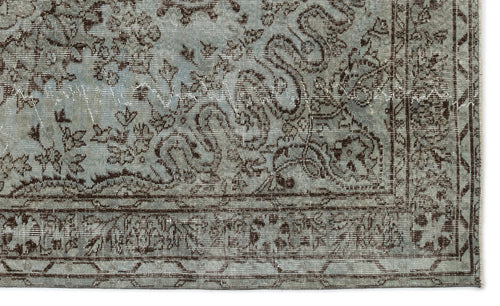 Load image 1 in gallery view. Light blue and dark brown distressed rug with a traditional floral and scrollwork pattern and a geometric border.