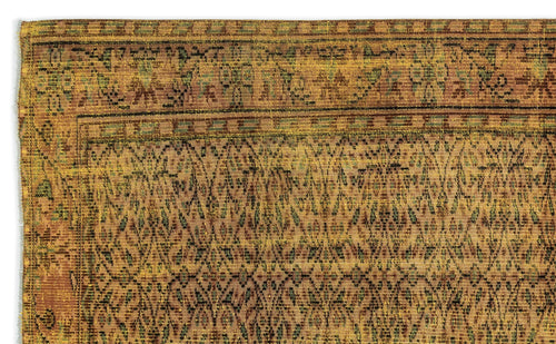 Load image 1 in gallery view. Mustard yellow and brown traditional rug with a repeating geometric diamond pattern and a decorative border.