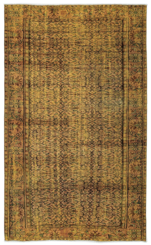 Load image 1 in gallery view. Distressed mustard yellow and brown vintage-style rug with an intricate repeating geometric pattern and a bordered edge.