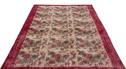 Load image 1 in gallery view. Distressed beige rug with a red floral pattern and a wide red border on a white background.