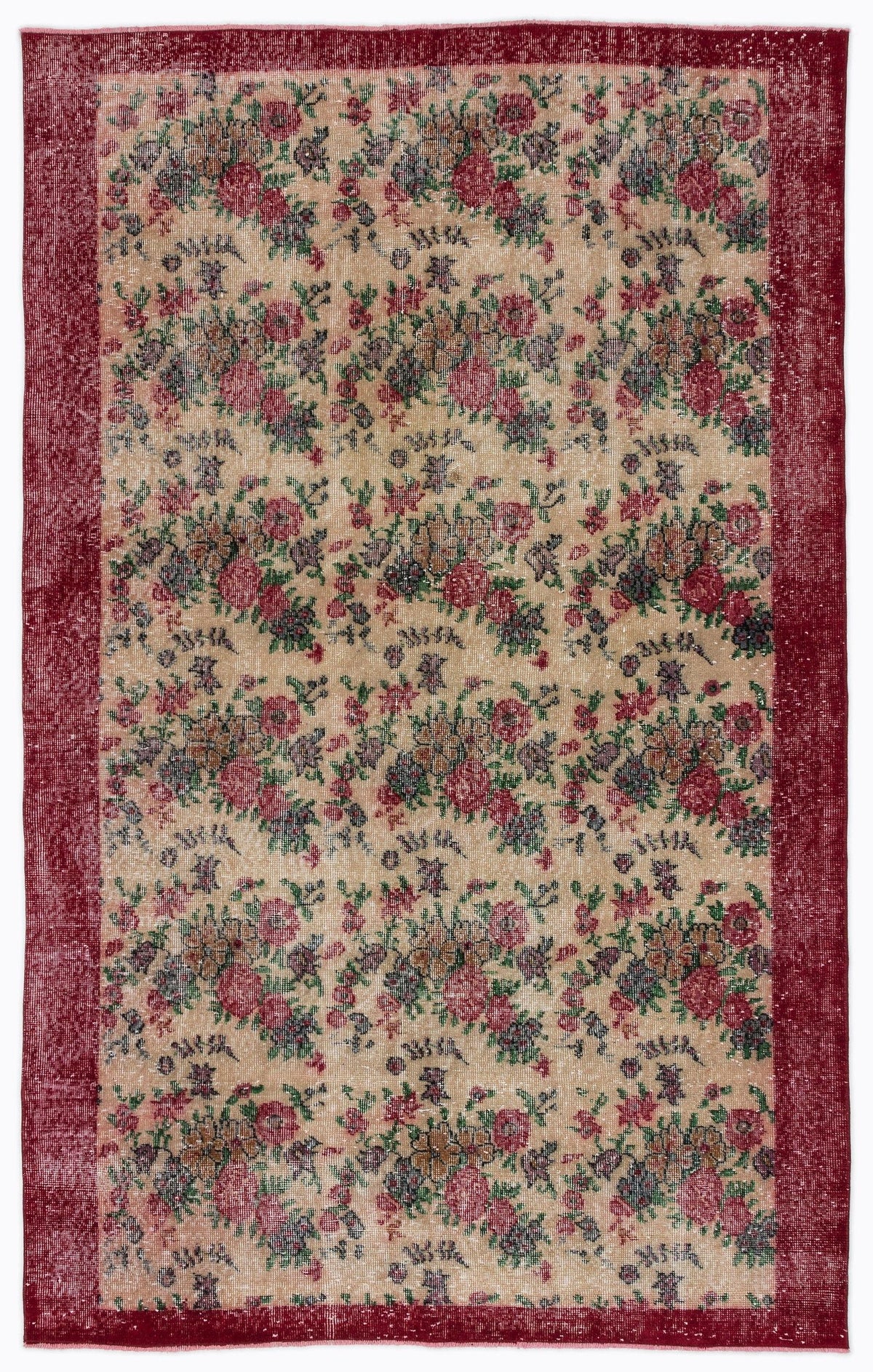 Distressed beige rug with a red floral pattern and a wide red border.