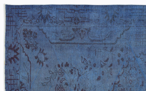 Load image 1 in gallery view. Deep blue rug with a dark, distressed floral and geometric line pattern on a white background.
