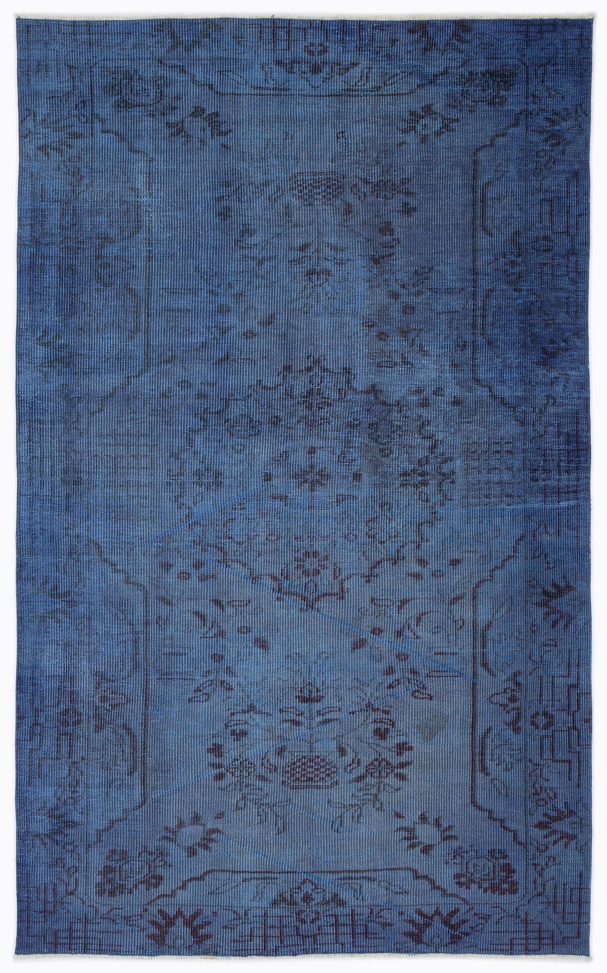 Monochromatic blue vintage-style rug with a faded, distressed traditional floral medallion pattern.