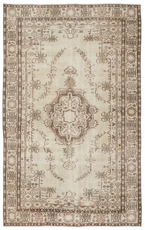 Load image 1 in gallery view. The Kidaen Vintage Medallion Rug (6'0 x 9'6) features a central medallion, ornate geometric and floral motifs in muted beige and brown, framed by a decorative border for a classic Anatolian-inspired look.