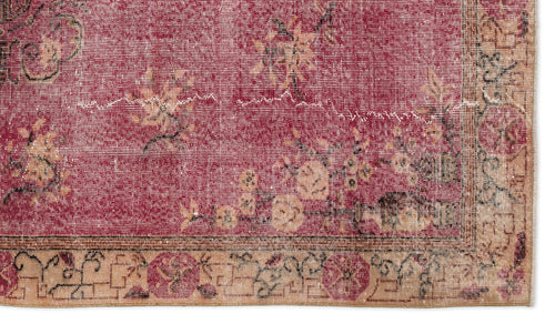 Load image 1 in gallery view. Distressed crimson rug with a faded floral pattern and a tan geometric border on a white background.