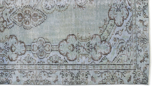 Load image 1 in gallery view. Distressed light blue and brown rug with a traditional floral medallion border pattern.