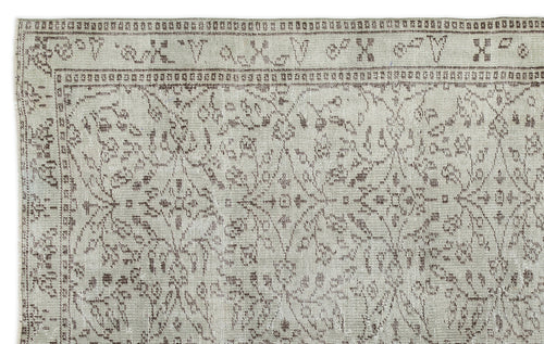 Load image 1 in gallery view. Light gray and brown vintage-style rug with a distressed floral medallion pattern and a geometric border.