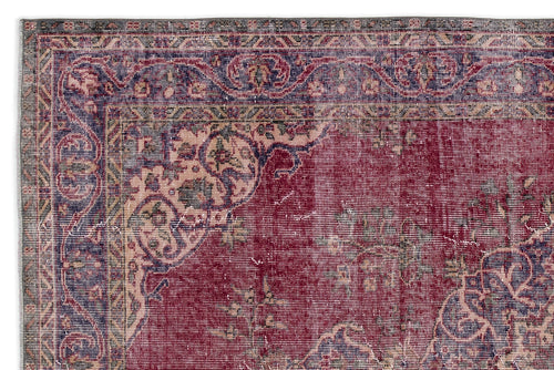 Load image 1 in gallery view. Distressed red, blue, and cream traditional rug with an ornate floral medallion border and faded central pattern.