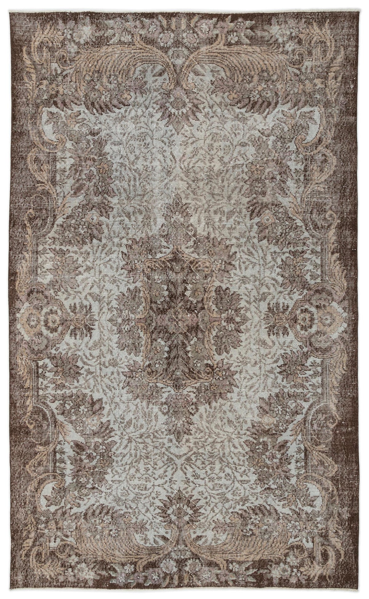 Distressed brown and light blue traditional rug with an ornate floral medallion pattern on a white background.