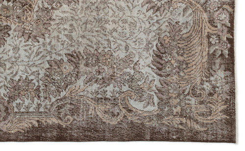 Load image 1 in gallery view. Brown and light blue traditional rug with a distressed floral medallion pattern.