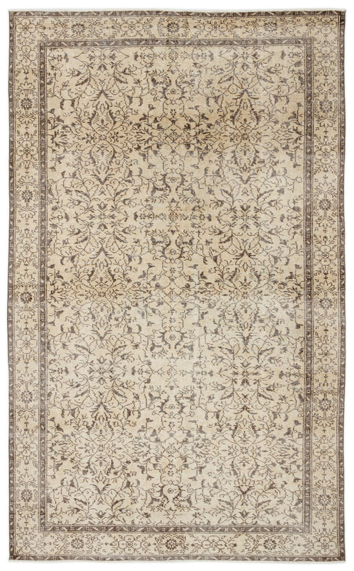 Load image 1 in gallery view. The Trabiane - Vintage Floral Rug (6'1 x 9'11) showcases a rectangular beige and brown design with intricate floral and vine patterns, decorative borders, and a symmetrical, hand-woven style for an elegant traditional look.