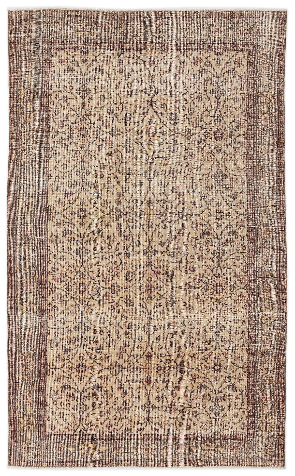 Distressed beige and brown rug with a traditional floral medallion pattern and a wide decorative border.