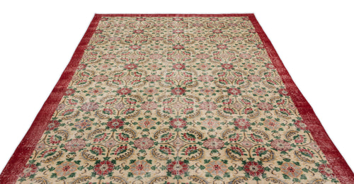 Load image 1 in gallery view. Beige rug with a red border and a repeating floral medallion pattern in red, green, and gold on a white background.