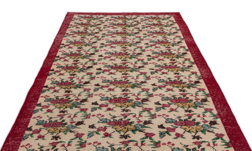Load image 1 in gallery view. Beige runner rug with a red border and a repeating floral pattern in red, green, and yellow on a white background.