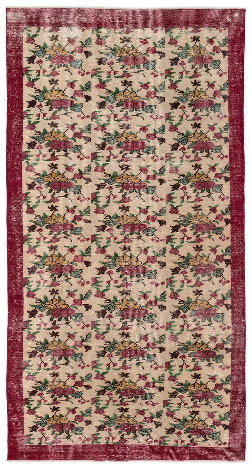 Load image 1 in gallery view. Beige runner rug with a repeating floral pattern in red, yellow, and green, framed by a solid red border.