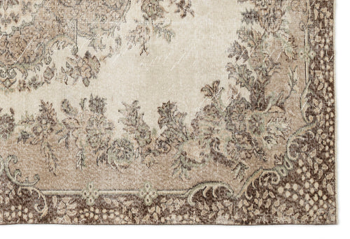 Load image 1 in gallery view. Beige and brown vintage-style rug with a distressed floral medallion pattern and a detailed border.