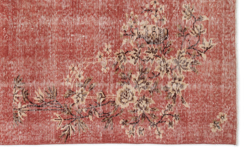 Load image 1 in gallery view. Distressed terracotta rug with a faded cream and brown floral branch pattern.