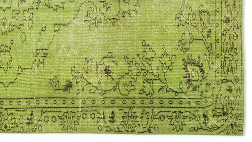 Load image 1 in gallery view. Lime green rug with a distressed dark brown floral and geometric border pattern on a white background.