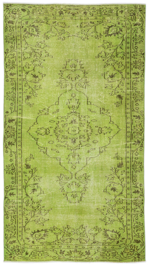Load image 1 in gallery view. Lime green vintage-style rug with a dark brown distressed floral medallion pattern and a decorative border.