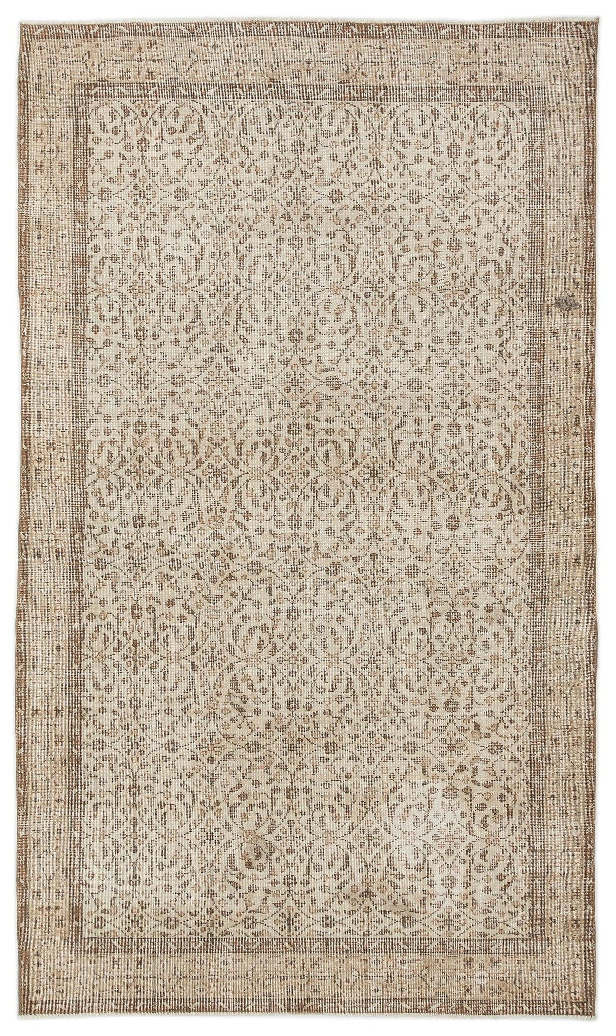 The Pavia - Vintage Floral Rug (5'7 x 9'5) is a rectangular Anatolian hand-woven piece with an intricate, symmetrical floral and vine pattern in beige, cream, and light brown, framed by detailed geometric and floral borders.