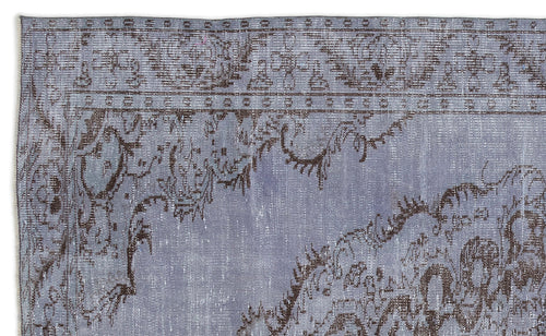 Load image 1 in gallery view. Periwinkle and dark brown distressed rug with a traditional ornate floral border and central medallion pattern.