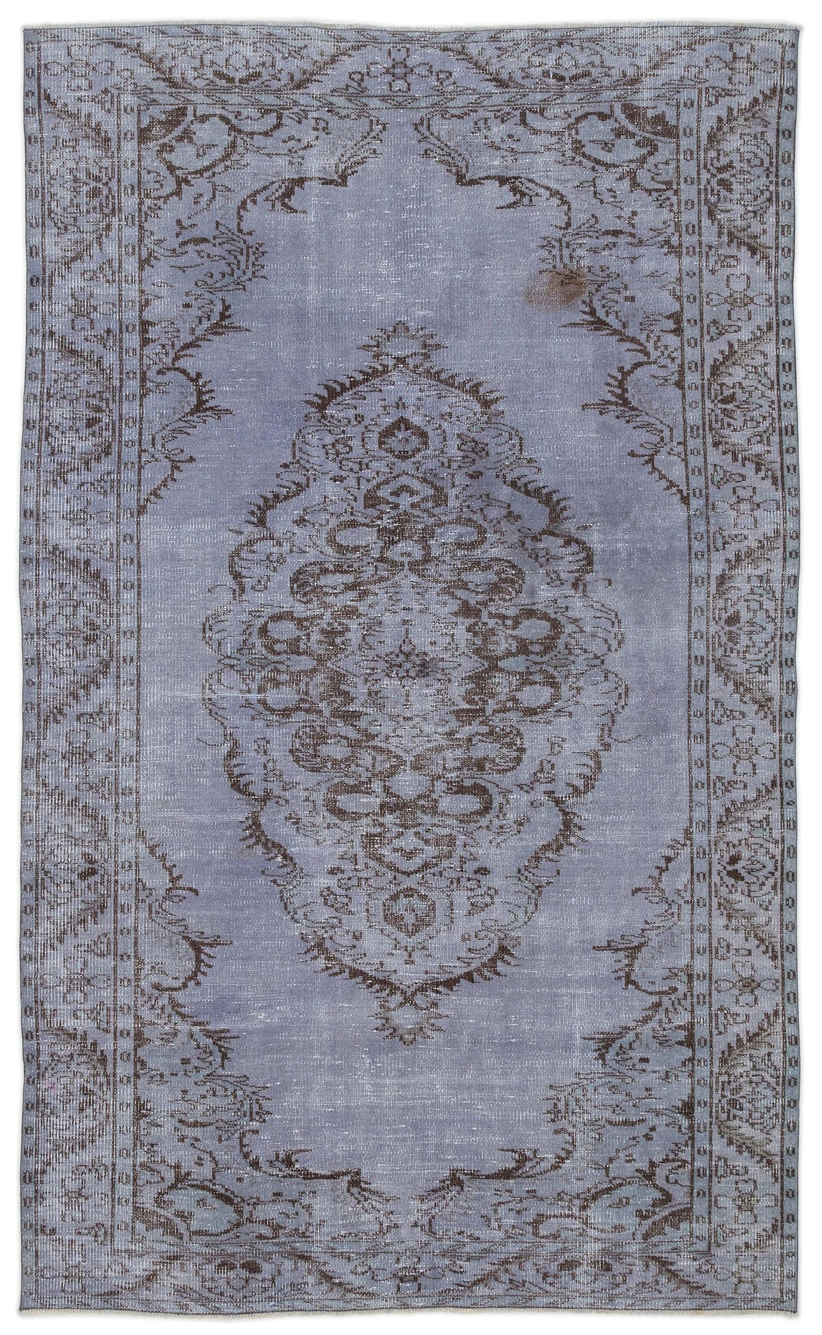 Distressed periwinkle blue rug with a dark brown central medallion and ornate floral border on a white background.
