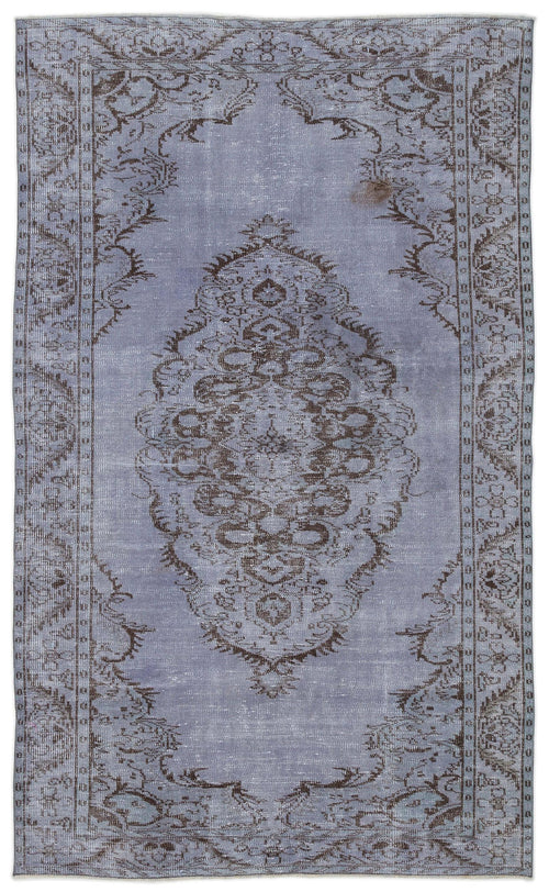 Load image 1 in gallery view. Distressed periwinkle blue rug with a dark brown central medallion and ornate floral border on a white background.