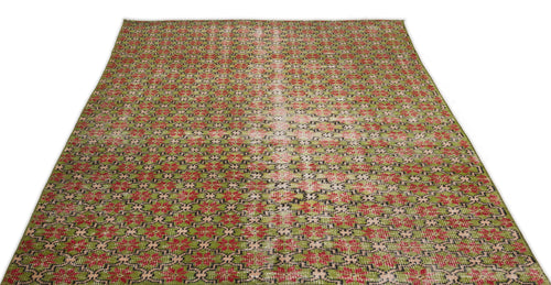 Load image 1 in gallery view. Green, red, and black geometric patterned rug with a distressed, faded center stripe on a white background.