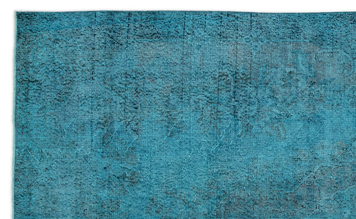 Load image 1 in gallery view. Teal and black distressed rug with a faded traditional medallion pattern on a white background.