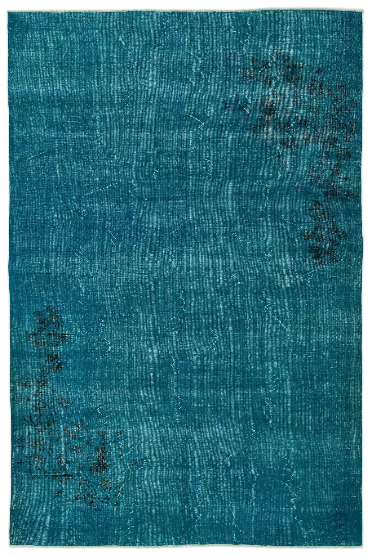 Teal distressed rug with subtle black floral motifs in opposite corners on a white background.