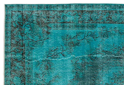 Load image 1 in gallery view. Teal and black distressed rug with a traditional floral medallion pattern and a decorative border.