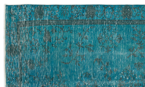Load image 1 in gallery view. Teal and dark grey distressed rug with a traditional floral medallion pattern and a fringed edge.